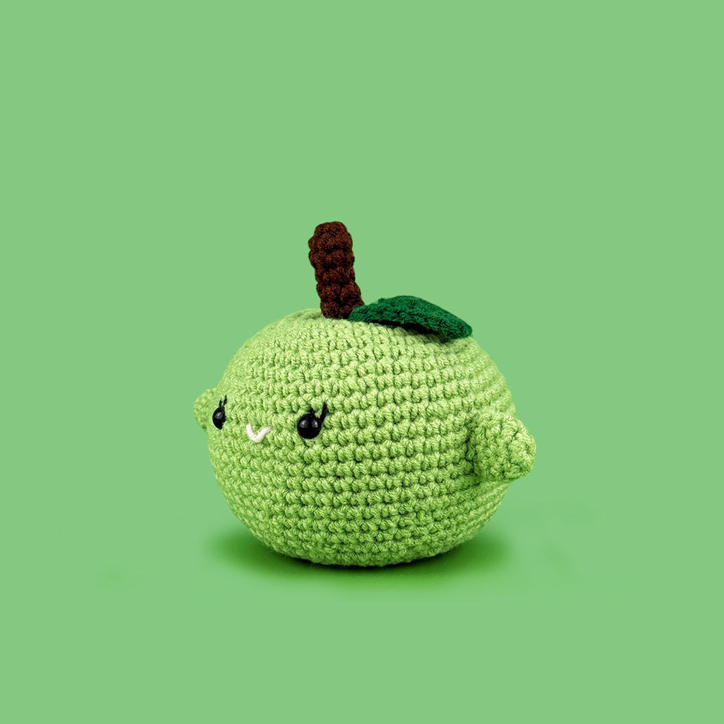 The Cute Crochet handmade apple - light green crochet apple with a cute face and stem 